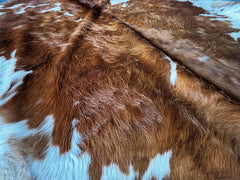 Brown and White Cowhide Rug