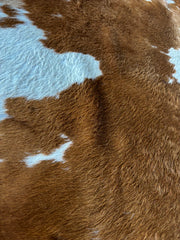 Brown and White Cowhide Rug