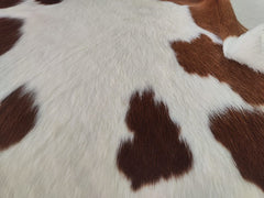 Brown and White Cowhide Rug